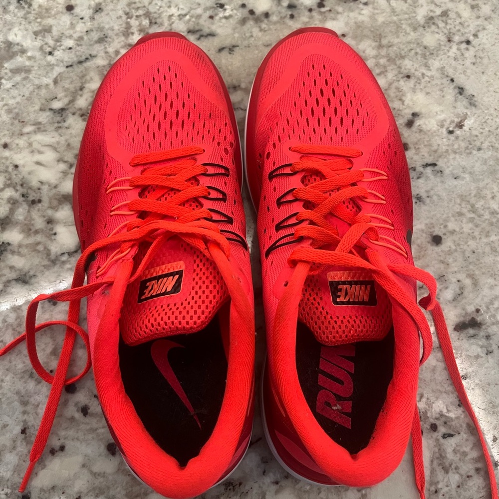 Hot pink Nike running shoes